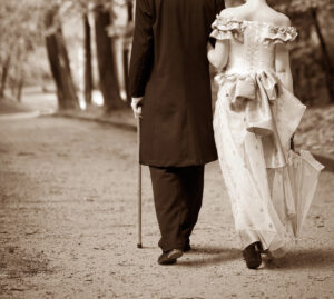 Photo of Gentleman and lady walking in a park, from rear, about 1820